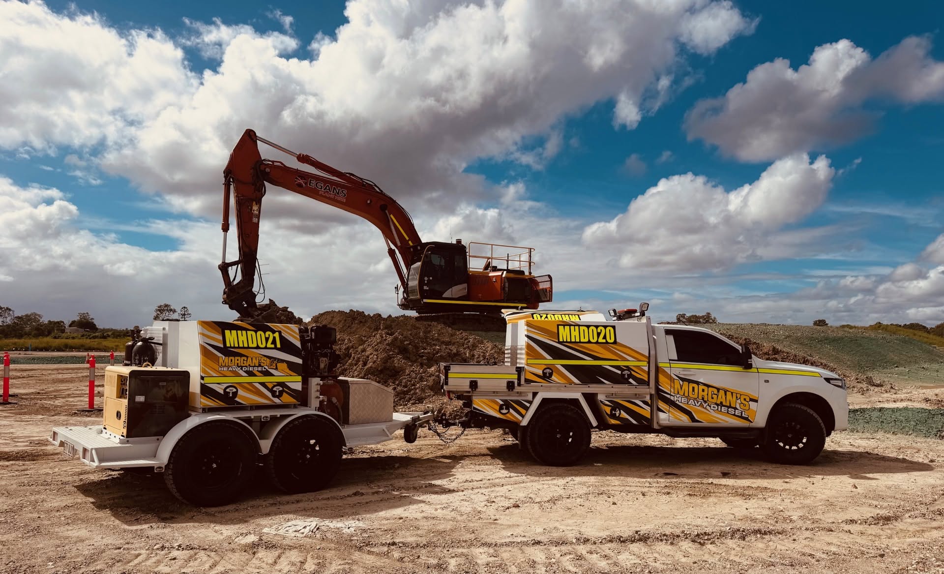 Brisbane, Morgan's Heavy Diesel twin service utes on civil excavation site