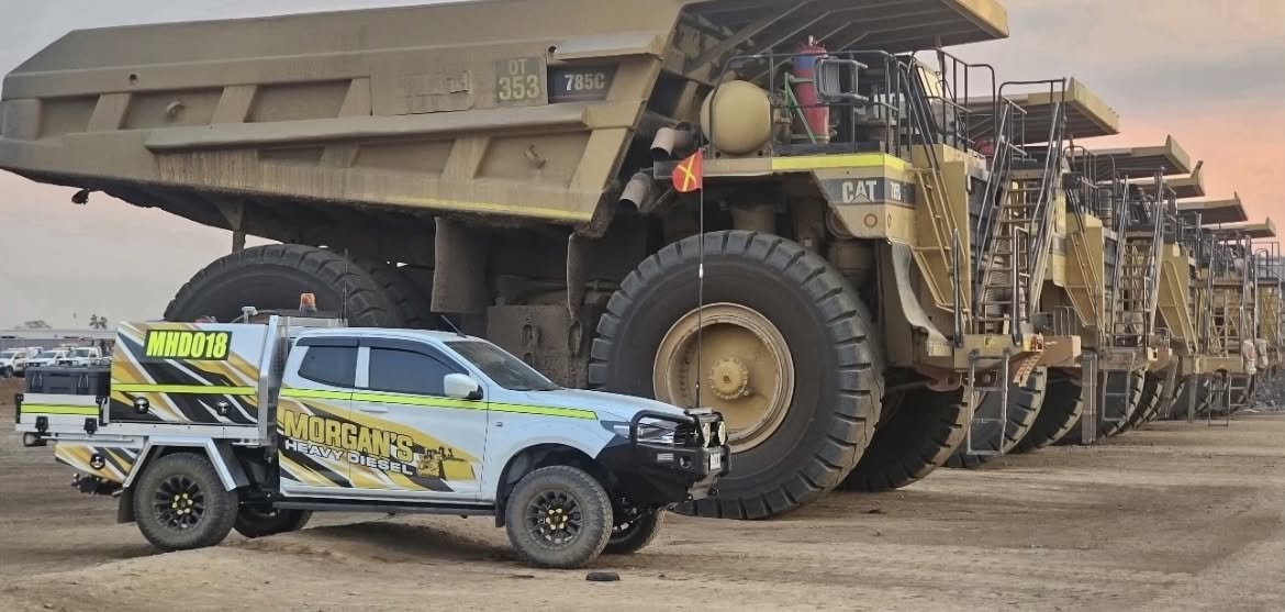 Brisbane, Morgan's Heavy Diesel service ute alongside CAT haul trucks